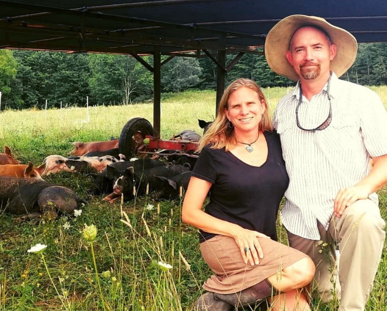 Holly and John Arbuckle with pastured pigs